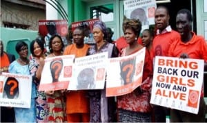 Senator Oluremi Tinubu (2nd-right), receiving symbolic picture of one of the kidnapped 'Chibok Girls' by the Coordinator of 'BringBackOurGirls' (BBOG), Lagos State branch, Mrs Yemisi Kuti, during a sit-out session with Sen. Oluremi Tinubu over the kidnapped 'Chibok Girls' and the Internally Displaced Persons (IDPs) in Lagos, yesterday. With them are from left: former member, Lagos State House of Assembly, Lola Akande and member, Federal House of Representatives, Rep. Jide Jimoh.