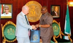 Rivers State Governor, Chief  Nyesom Wike (right), presenting a souvenir to the Ireland Ambassador to Nigeria, Mr. Sein Hoy, during a courtesy call in Government House, Port Harcourt, recently.