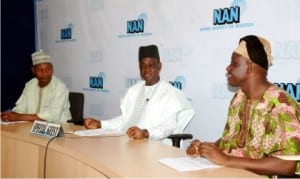 L-R: Head of Economic Desk, News Agency of Nigeria (NAN), Mr Idris Abdulrahman, Director-General, Small and Medium Enterprises Development Agency of Nigeria (SMEDAN), Alhaji Bature Masari and Assistant Editor-In-Chief, NAN, Rev. Felix Ajide, during NAN’s Forum in Abuja on Tuesday.       Photo: NAN