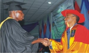 Governor Nasir El-Rufai of Kaduna State (right), presenting a certificate to the best Student, Flt. Lt. Christian Mensah, at the 44th Convocation of Air Force Institute of  Technology, in Kaduna on Wednesday. 