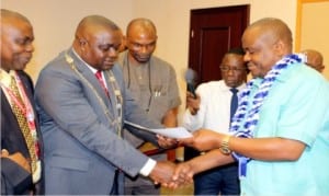 Rivers State Governor, Chief Nyesom Ezenwo Wike (right), receiving a certificate from the President of Nigeria Institute of Estate Surveyors and Valuers (NIESV), Mr. Olurugun James Omeru, as the Grand Patron of the institute, during a courtesy call in Government House, Port Harcourt recently.
