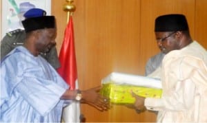 Vice Chancellor University of Maiduguri, Prof. Ibrahim Njodi (right) presenting  souvenir to Gov. Ibrahim Dankwambo of Gombe State, during a visit to the Governor in Gombe on Monday.