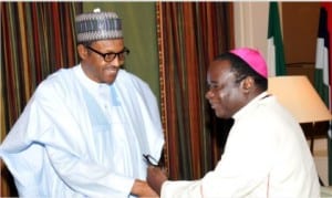 President Muhammadu Buhari  (left), welcoming Bishop Matthew Hassan Kukah  of  Catholic Diocese of Sokoto at the Presidential Villa in Abuja, yesterday