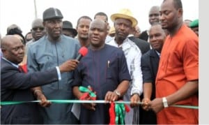 Governor Nyesom Wike of Rivers State (middle), Chairman, Caretaker Committee, Akuku-Toru LGA, Hon. Odimabo Torukwein (right),former Commissioner for Works, Chief David Briggs (2nd left) and former Minister of Sports, Hon. Tammy Danagogo (3rd right), during the commissioning of Abonnema/Obonoma Bridge in Abonnema, yesterday. Inset is the bridge