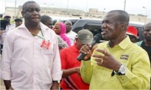 Commissioner for Works, Bayelsa State, Mr Lawrence Erujakpor (right), explaining a point to the Zonal Manager, South-South, News Agency of Nigeria (NAN), Mr Mike Mbonye, during a tour of development projects as part of activities to mark the 2015 Nigerian Editors Conference in Yenagoa, recently. Photo: NAN