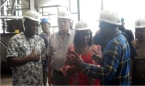 Former Sole Administrator, Risonpalm, Mr Ejims Enwukwe (right), explaining a point of interest to Rivers State Commissioner for Agriculture, Mrs Onimim Jacks, during an inspection of Siat plant in Ubima, recently