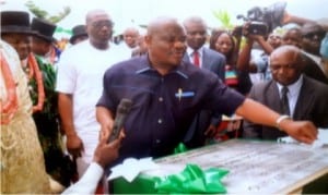 Rivers State Governor,Chief Nyesom Wike, unvailing a plague at the commissioning of 50 medium income housing units at Iriebe in Port Harcourt last Friday.                                       Photo: Ibioye Diama