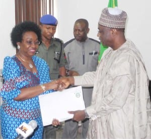 Outgoing Head of the Civil Service of the Federation, Mr Danladi Kifasi (right), handing over to his successor, Mrs Winifred Eyo-Ita in Abuja, yesterday.