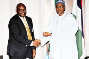 President Muhammadu Buhari (right), receiving his new National Identity Card from the Director-General, National Identity Management Commission (NIMC), Mr Chris Onyemenam, at the Presidential Villa in Abuja on Wednesday.