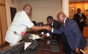 Rivers State Governor,  Chief Nyesom Ezenwo Wike (left), congratulating  Barrister Harvey Ideozu, after being sworn-in as Special Adviser to the Governor in Government House, Port Harcourt, recently.