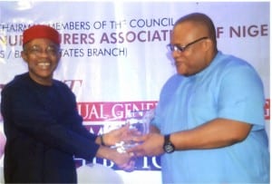 Secretary to Rivers State Government, Chief Kenneth Kobani (right), receiving an award of excellence  from the President, Manufacturers Association of Nigeria, Dr Frank Jacobs, during the association’s Annual General Meeting/First Made in Nigeria Exhibition in Port Harcourt, recently.                           Photo: Egberi  A. Sampson