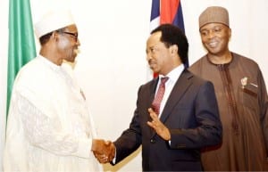 President Muhammadu Buhari (left), in a handshake with Senator Shehu Sani (2nd right), during a presidential dinner in honour of Senators at thePresidential Villa in Abuja on Wednesday. With them is Senate President, Bukola Saraki.