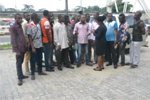 Ex-militants led by their spokesman, Mr Fyneface Otokiri (middle), expressing grief over non-payment of their allowances  to The Tide  reporter, Iragunima Benice, during a peaceful protest in Port Harcourt, yesterday