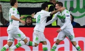 Wolfsburg players celebrating their victory over Manchester United after their elimination from the Champions League