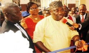 L-R: Chief Executive Officer, Copen Group, Rev. Ugo Chime, Managing Director of the Group, Mrs Chinelo Chime, Governor Ifeanyi Ugwuanyi of Enugu State, and President, Enugu Chamber of Commerce, Industry, Mines and Agriculture, Dr Ifeanyi Okoye, at the commissioning of Elim Plaza in Enugu on Wednesday