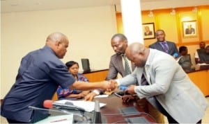 Rivers State Governor, Chief Nyesom Ezenwo Wike (left), swearing-in the Caretaker Committee Chairman of ONELGA, Prince Isaac Umejere at the Government House, Port Harcourt on Wednesday. 