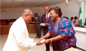 Rivers State Deputy Governor, Dr. (Mrs) Ipalibo Harry Banigo, presenting a gift to Chief Darlington Kinikanwo, one of the Government House Retirees, during  Christmas carol/sendforth party she  organised in Government House, Port Harcourt on Wednesday.