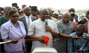 Rivers State Governor, Chief Nyesom Wike (middle), commissioning the Abuloma/Woji Road project in Port Harcourt on Thursday. With him are his deputy, Dr (Mrs) Ipalibo Harry Banigo (left) and Speaker, Rivers State House of Assembly, Rt Hon. Adams Dabotorudima (2nd right)