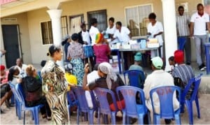 Medical officers attending to people, during the National Agency for Control of AIDS/SURE-P free medical outreach in Isuochi community in Abia State, recently