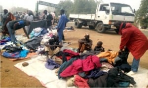 People purchasing fairly used warm clothings against Harmattan at Alocakl Market in Dutse, Jigawa State, recently