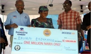 Chief Marketing Officer, Dangote Group, Mr Oare Ojeikere (left), beneficiary, Mrs Ebiokpo Endurance (middle) and South-South Zonal Cordinator, Prince Chinonye Ikegwuraka with the cheque,during a mega million promo in Port Harcourt, recently. Photo: Nwiveh Donatus Ken