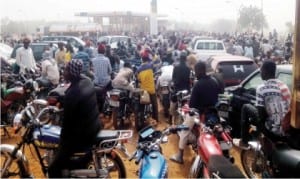 A crowd of people waiting to purchase petrol at the NNPC Mega Station in Dutse, Jigawa State, as fuel scarcity intensifies recently.