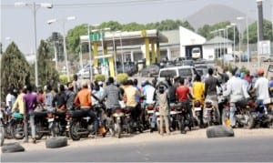 Commercial motorcyclists waiting to buy fuel at a filling station in Giri, Abuja on Thursday