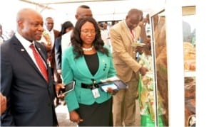 L-R: Vice-Chancellor of Covenant University, Prof. Charles Ayo, who represented Bishop David Oyedepo, Vice-Chancellor of Landmark University, Prof. Aize Obayan and Deputy Vice-Chancellor of Landmark University, Prof. Enoch Oyawoye, inaugurating an exhibition, during the 6th matriculation ceremony of the university in Omu-Aran, Kwara State on Friday