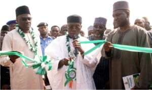 L-R: Governor Abdulfatah Ahmed of Kwara State, Minister of Agriculture and Rural Development, Chief Audu Ogbe and Vice President, Dangote Group, Alhaji Sani Dangote, at the inauguration of the second phase of Agricultural Equipment Hiring Enterprise at the National Centre for Agricultural Mechanisation in Ilorin, yesterday
