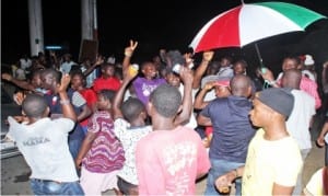 PDP supporters celebrating re-election of Governor Seriake Dickson in Bayelsa State governorship election, at the gate of the Government House in Yenagoa on Sunday.