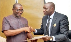 Sponsor, Go-Round/SWAN Secondary School Athletics Championship, Mr Felix Obuah (left), presenting the championship's programme to Rivers State Commissioner for Education, Prof. Kaniye Ebeku, during the visit of the organising committee of the forthcoming championship to the Commissioner in Port Harcourt, yesterday