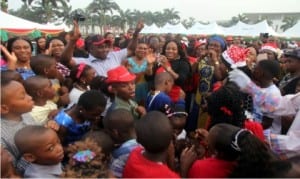 Wife of  Rivers State Governor,  Justice Suzzette Nyesom-Wike, dancing with  Rivers  children  during a special party organised for them at Government House in Port Harcourt, recently. 