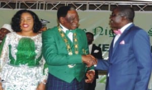 The outgoing President of Nigeria Society of Engineers (NSE), Mr Isaac Olorunfemi (right), congratulating the incoming President, Mr Otis Anyaeji (middle), during his investiture as the 30th President of the body in Abuja, recently. With them is the wife of the incoming President, Mrs Nkechi Anyaeji