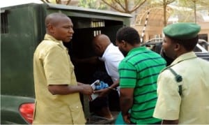 Suspected Independent Day bombers, Mr Charles Okah (2nd left) and Obi Nwabueze (2nd right), returning to prison after appearance at the Federal High Court in Abuja on Monday.