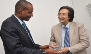 President, Abuja Chamber of Commerce and Industry Limited, Mr Tony Ejinkeonye (left), presenting a plaque to the Ecuadorian Ambassador to Nigeria, Mr Leopoldo Verdesoto, after a business meeting at the chamber in Abuja, yesterday.