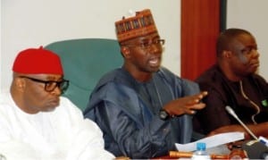 Vice Chairman, House of Representatives Adhoc Committee on Crude oil SWap, Rep. Toby Okechukwu, Chairman, Rep. Zakari Mohammed and a member of the committee, Rep. Gebriel Onyenwife, at a news conference on activities of the commttee in Abuja, recetnly