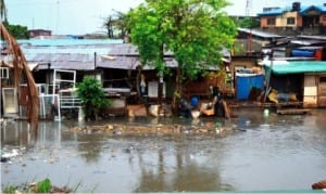 Flood as a result of the first rainfall at Iyana Oworo in Lagos last Tuesday