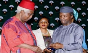 Vice President Yemi Osinbajo (right), presenting an Award of the Icon of Democracy’ to former Vice President, Dr Alex Ekwueme, at the 2016 Annual National Political Summit in Abuja on Monday