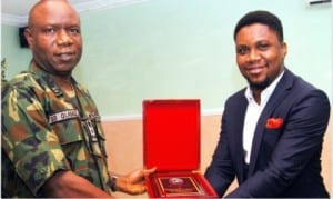 Commander, 2 Brigade, Nigerian Army, Brig.-Gen. Stevenson Olabanji (left), presenting  an award to the Guest Lecturer, Mr Kofi Bartels, at the training on Military-Media Relations on Internal Security Operations in the Niger Delta, in Port Harcourt  yesterday