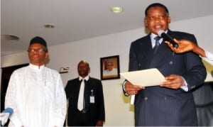 Chairman, Army-Shitee Clash Judicial Commission of Inquiry, Justice Mohammed Garba (right), taking oath of office before Governor Nasir El-Rufai of Kaduna State, during the inauguration of the judicial commission of inquiry in Kaduna on Friday.