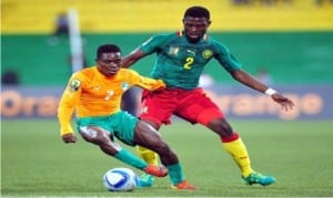 An Ivorian player (2) dancing beyond a Cameroonian defender in the CHAN quarter final match on Saturday