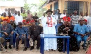 Regent of Egi Kingdom, HRM Eze London Nwaobiyebe (standing), addressing the people of Erema community, in Rivers State, during a meeting in the community, recently