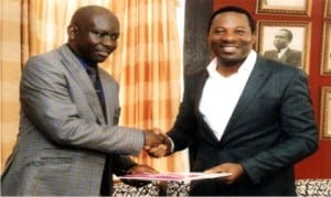 Rivers State Commissioner for Information and Communications, Dr Austin Tam-George (right), receiving a document from President, (Nigeria Institute of Public Relations (NIPR), Dr Rotimi Oladele, during a courtesy visit to the commissioner in Port Harcourt, yesterday