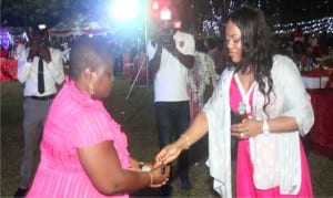 Wife of Rivers State Governor, Justice Suzzette Nyesom Wike (right), handing over a Kia Soul to the winner  of  the  Valentine Raffle Draw, Mrs Boma Abiasco, during the Couples Night and Special  Valentine Raffle Draw for public  officials  and their spouses at Government House, Port Harcourt, recently.