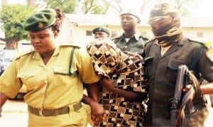 A woman who stabbed her husband   to death, Yewande Oyediran (middle), being arraigned in Iyaganku Magistrate Court in Ibadan, yesterday.