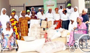 Coordinator, Nnaemela Foundation, Enugu, Rev. Sis. Kate Nnamonu (8th right) with officials and inmates of Our Lady of Perpetual Help Home for the Elderly, during a donation of food and essential materials to the home in Enugu, yesterday.