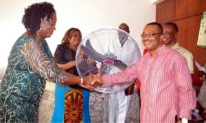 General Manager, Rivers State Newspaper Corporation, Mr Celestine Ogolo (right), congratulating a retired staff of the corporation, Mrs Dickba Cookey (left), during a sendforth party in Port Harcourt recently. With them are Director of Publications, Mrs Juliet Njiowhor and Director of Production, Chief Dagogo Clinton (middle)Photo: Ibioye Diama 