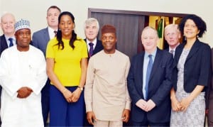 Vice President Yemi Osinbajo (middle), with delegation from the United Kingdom Trade Mission, during its visit to the Presidential Villa in Abuja, recently