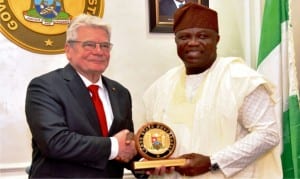 Governor Akinwunmi Ambodi of Lagos State (right), presenting a souvenir to the German President, Mr Joachim Gauck, during his visit to Lagos State, recently.