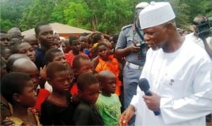 Comptroller General of the Nigerian Customs Service (ncs), Retired Col. Hameed Ali, (right), addressing some children in the Internally Displaced Persons (idps) Camp in Uhogua community, Ovia North East LGA in Edo State on Friday